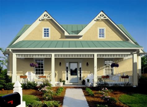 brick house with green metal rood and yellow door|metal roof for brick house.